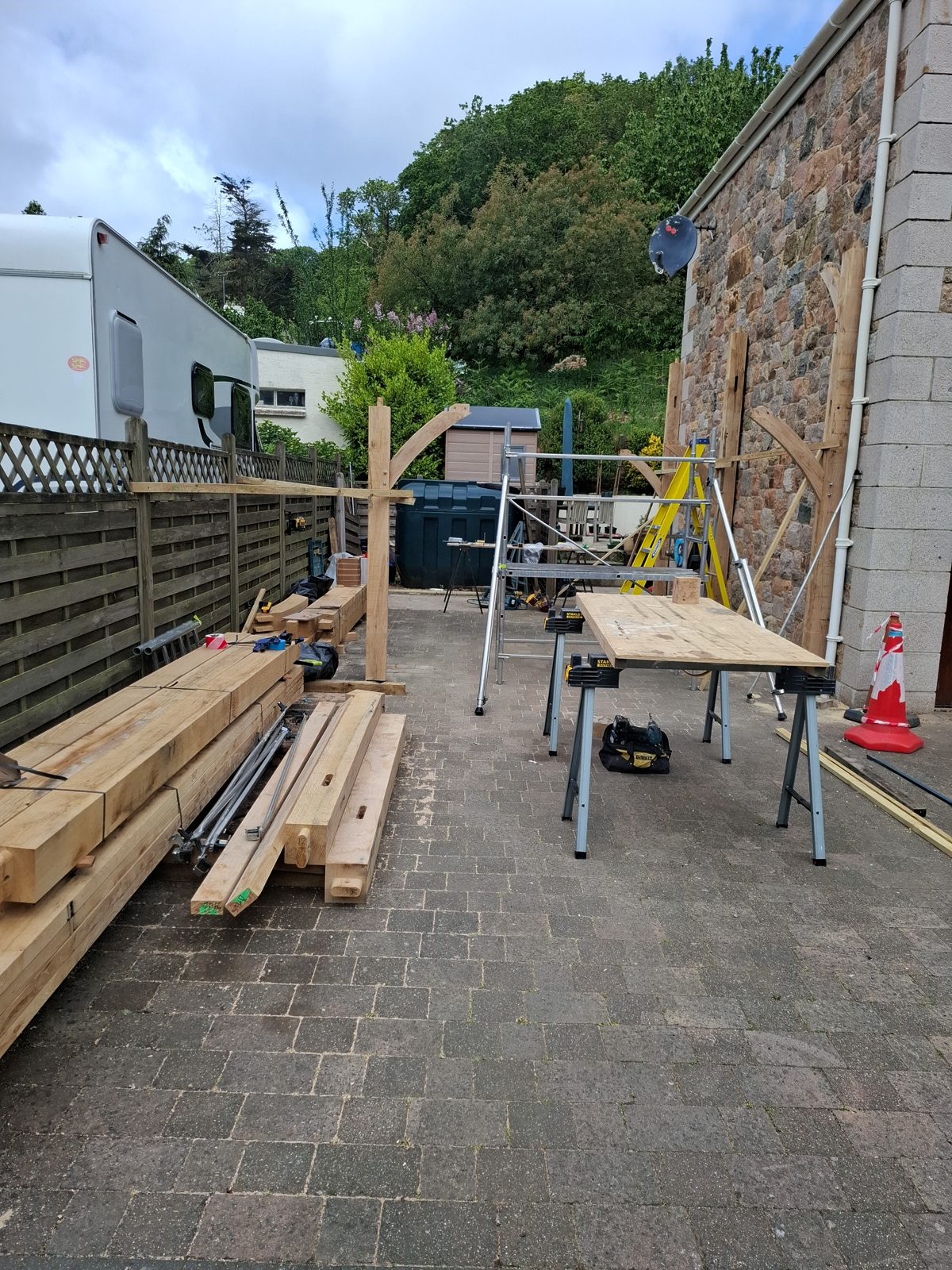 Oak stacked, benches set up: Oak carport in St Mary project photo 01