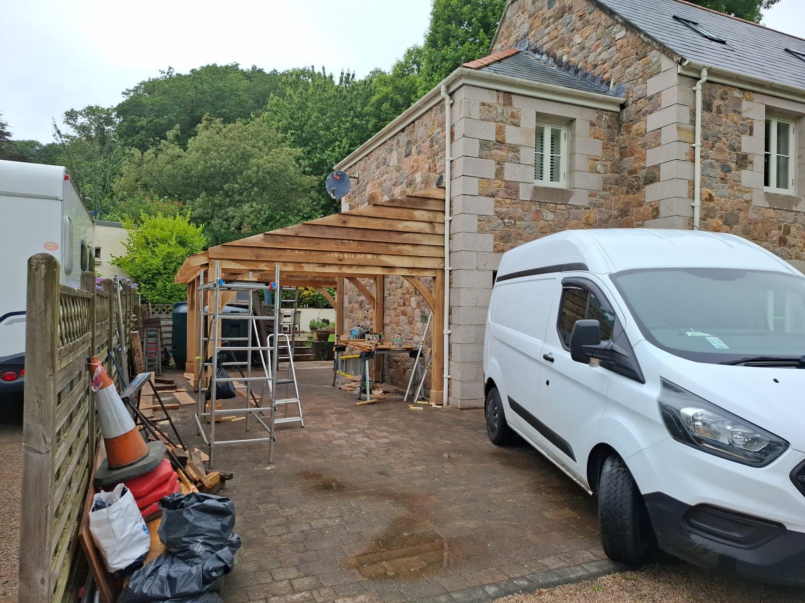 Roof falls and boarding going on: Oak carport in St Mary project photo 04