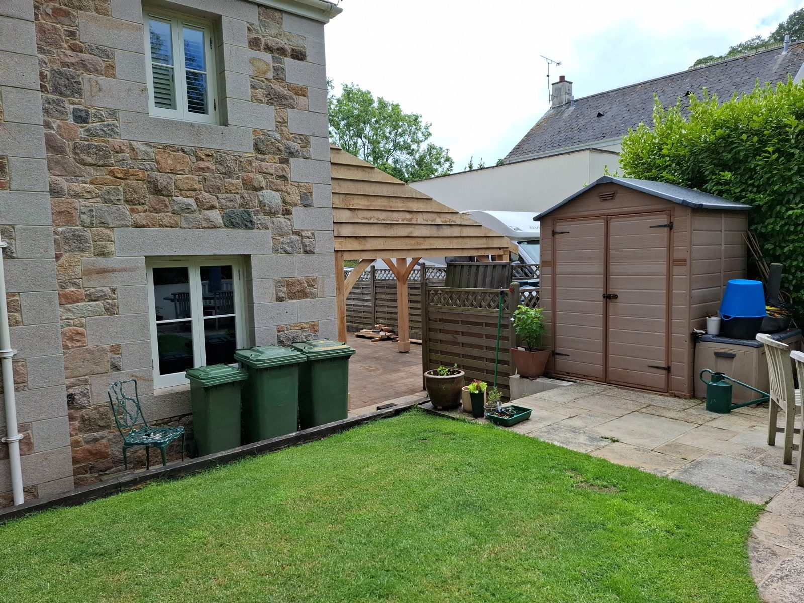 From the garden, tied to the gable: Oak carport in St Mary project photo 05