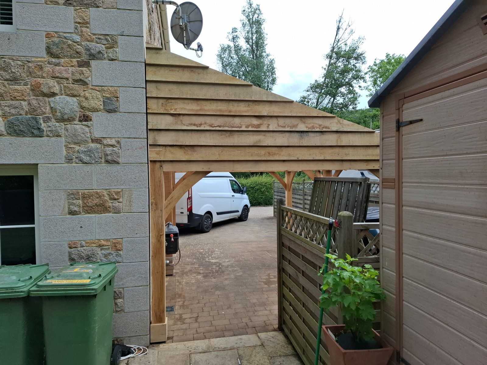 Looking through to the drive: Oak carport in St Mary project photo 06