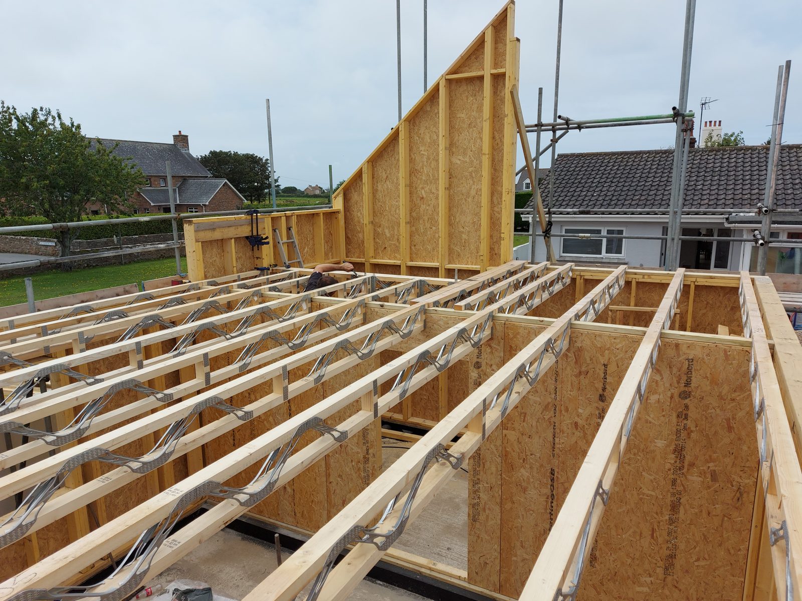 Gable spandrel and metal web joists: Timber frame new build project photo 02